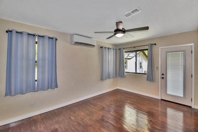 90 Blanton Rd, Lumberton, TX 77657 - spare room featuring a wall mounted air conditioner, hardwood / wood-style floors, and a ceiling fan
