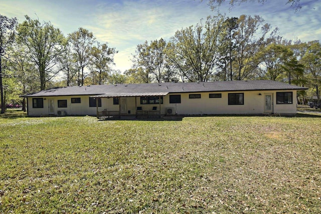90 Blanton Rd, Lumberton, TX 77657 - rear view of house featuring a lawn