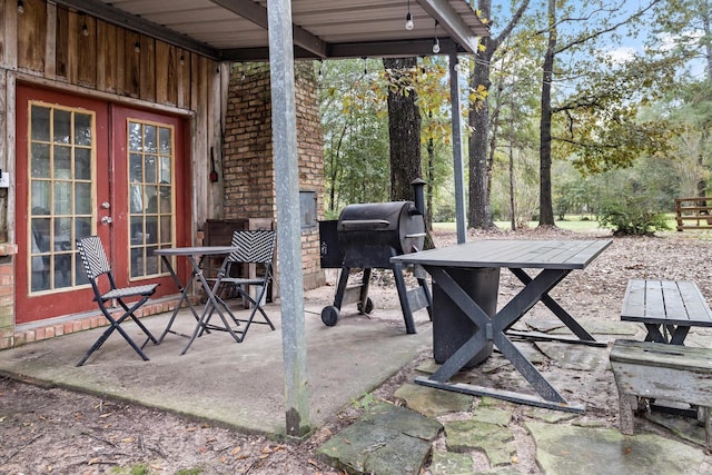 6531 Childress Ln, Kountze, TX 77625 - view of patio with french doors and a grill