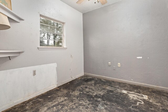 6531 Childress Ln, Kountze, TX 77625 - spare room with a ceiling fan, unfinished concrete flooring, and baseboards