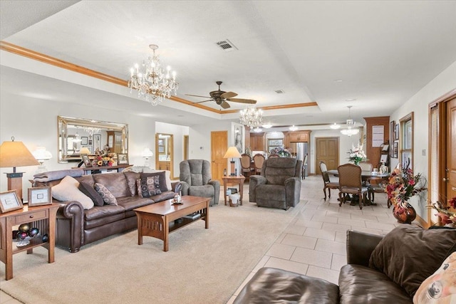 carpeted living room with a raised ceiling and ceiling fan