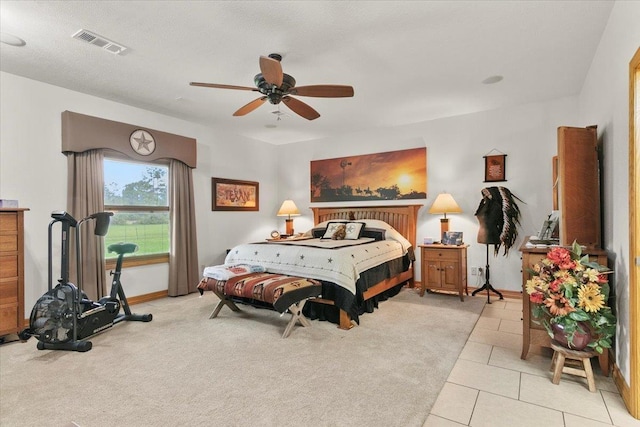 tiled bedroom with ceiling fan