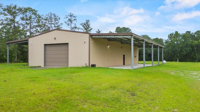 exterior space with a lawn and a carport