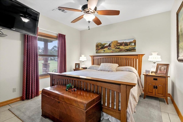 tiled bedroom with ceiling fan