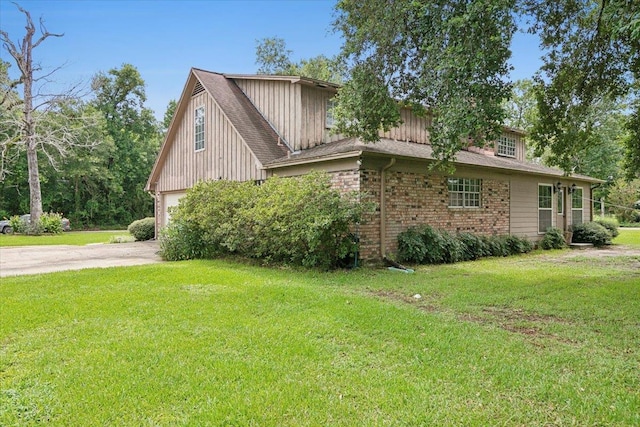 view of side of property with a lawn