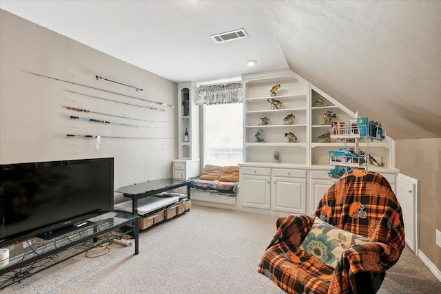 sitting room featuring lofted ceiling and light carpet