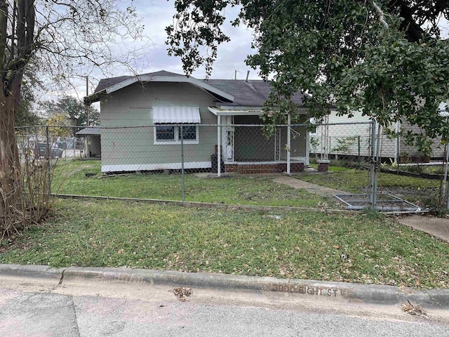 bungalow with a front yard