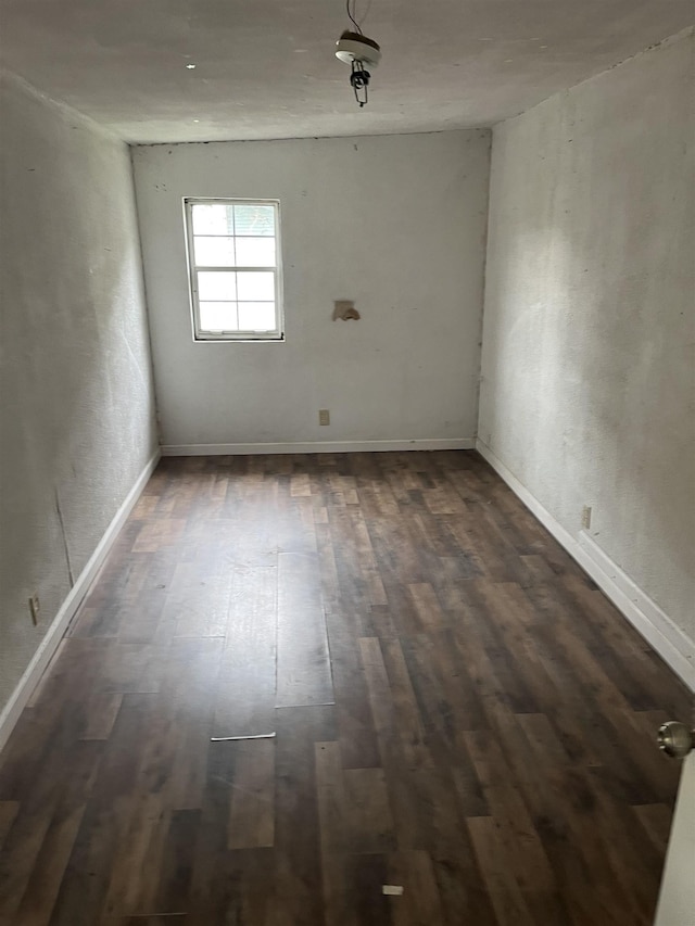 spare room featuring dark hardwood / wood-style floors