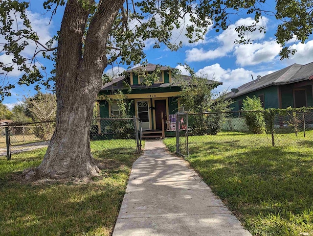 bungalow-style home featuring a front lawn