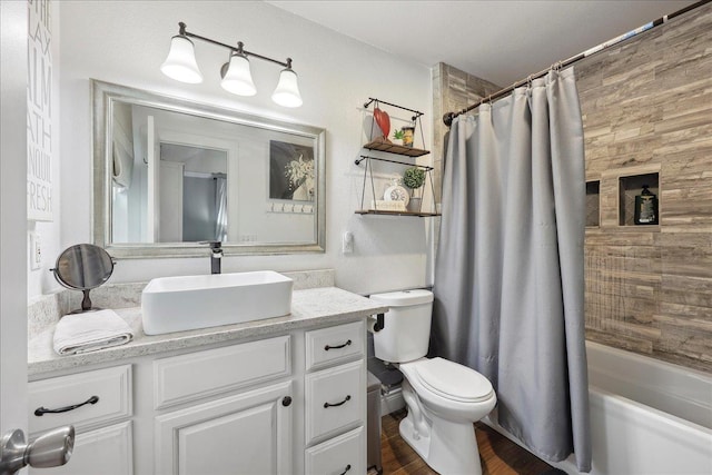 full bath with vanity, toilet, and shower / tub combo with curtain