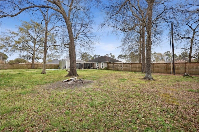 view of yard featuring a fenced backyard