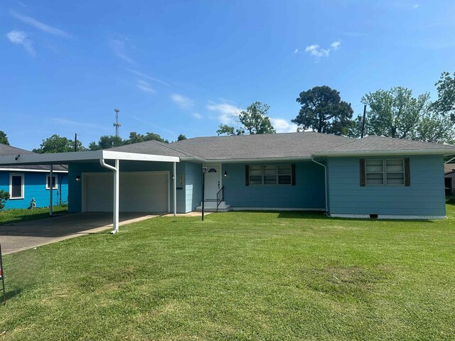 2938 Graves Ave, Groves, TX 77619 - ranch-style home with an attached garage, driveway, and a front yard