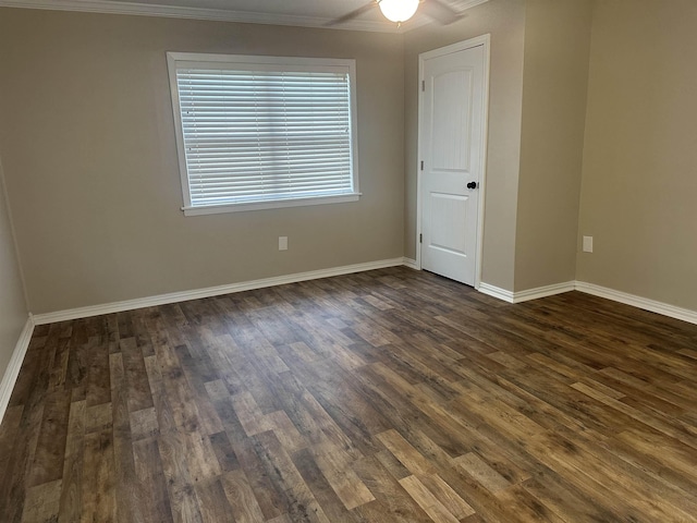 2938 Graves Ave, Groves, TX 77619 - unfurnished room featuring dark wood-style flooring, crown molding, and ceiling fan