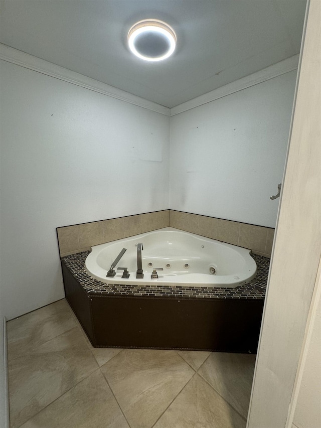 full bathroom with a tub with jets and tile patterned floors