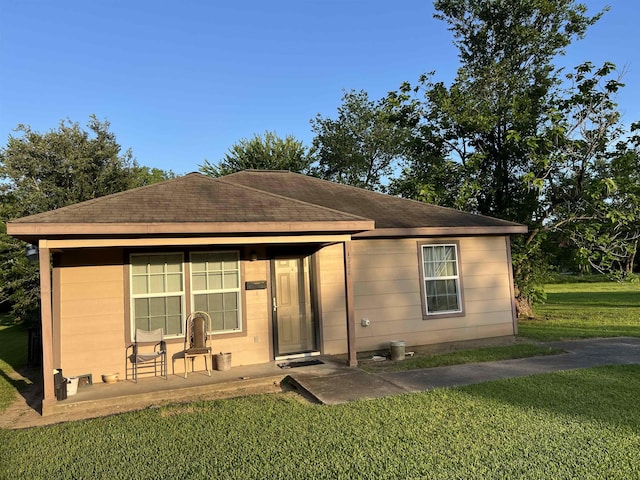 1928 Rev Dr Ranson Howard St, Port Arthur, TX 77640 - ranch-style home featuring a front lawn and roof with shingles