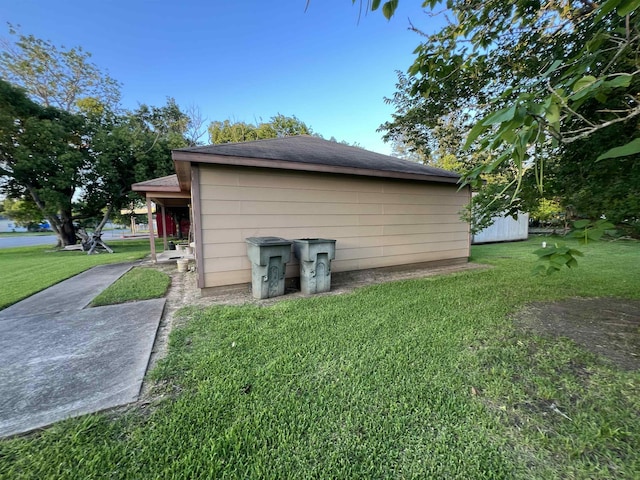 1928 Rev Dr Ranson Howard St, Port Arthur, TX 77640 - view of home's exterior with a lawn and roof with shingles