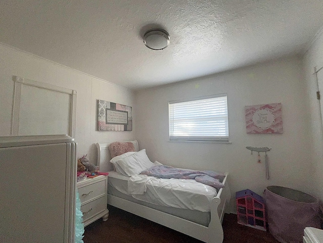 bedroom featuring a textured ceiling