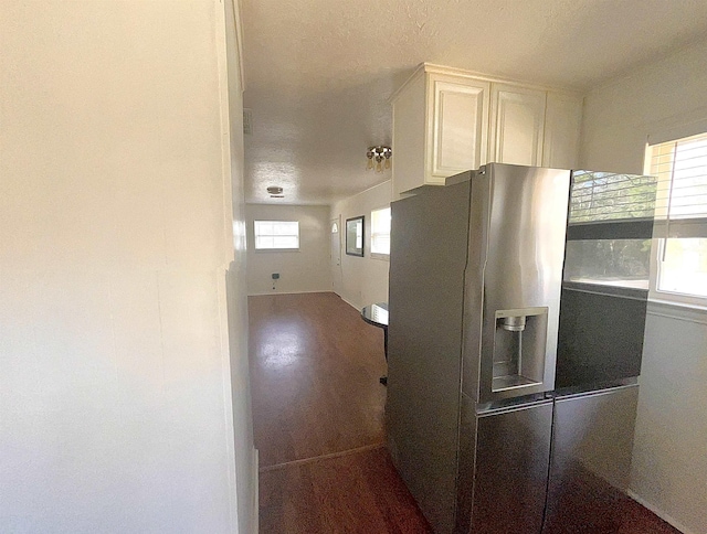 kitchen featuring stainless steel fridge with ice dispenser