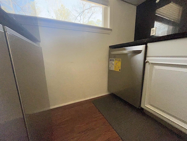 interior space featuring wood finished floors and baseboards