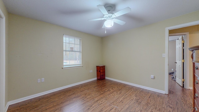 unfurnished bedroom with hardwood / wood-style floors and ceiling fan