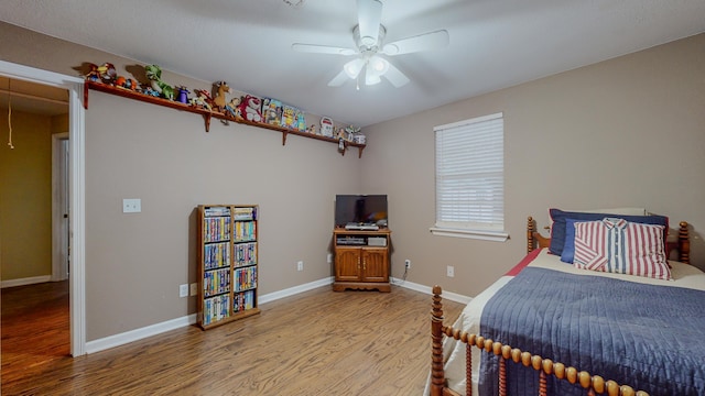 bedroom featuring light hardwood / wood-style flooring and ceiling fan