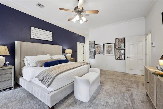 bedroom featuring visible vents, ornamental molding, baseboards, ceiling fan, and carpet