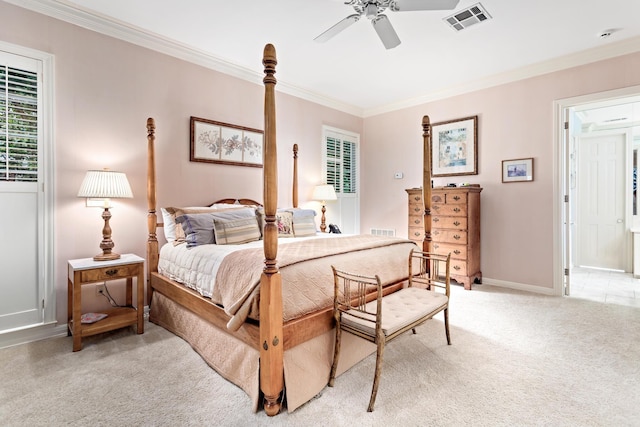 bedroom featuring light colored carpet, ceiling fan, and ornamental molding