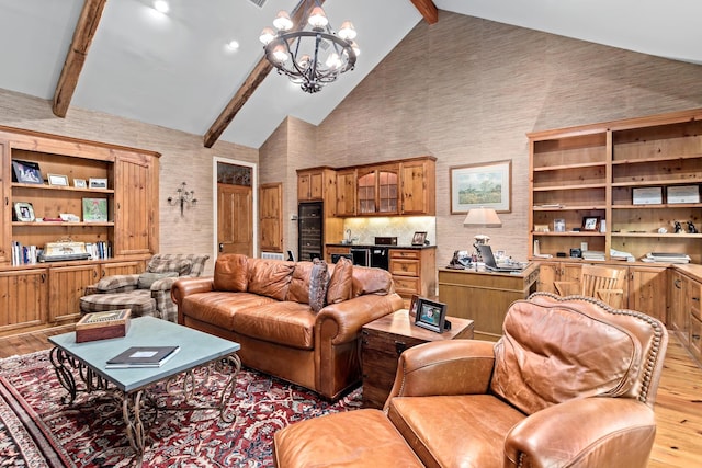 living room featuring a chandelier, beam ceiling, light hardwood / wood-style flooring, and high vaulted ceiling