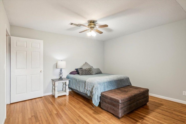 bedroom with ceiling fan and light wood-type flooring