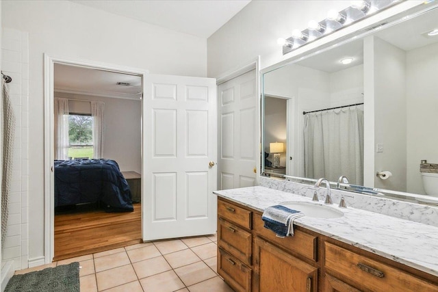 bathroom with tile patterned flooring and vanity