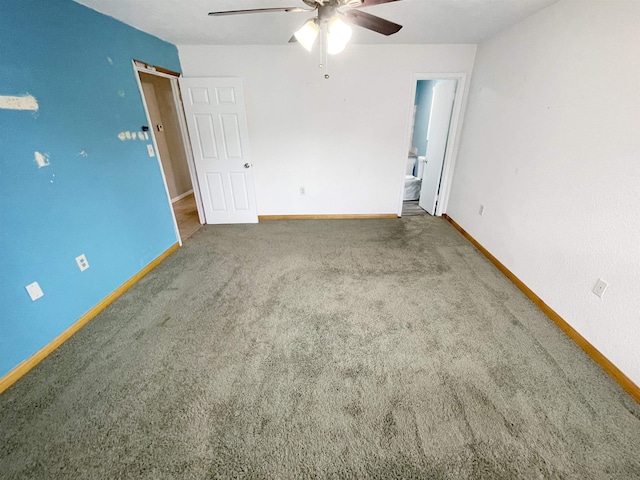 empty room featuring ceiling fan and carpet floors