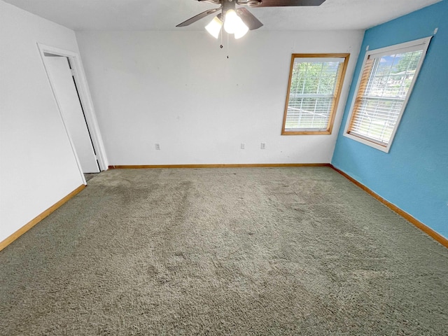 unfurnished room featuring carpet floors and ceiling fan