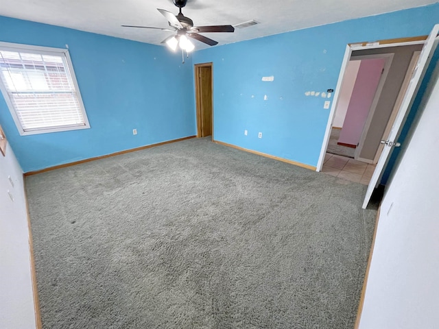 unfurnished bedroom with carpet flooring and ceiling fan