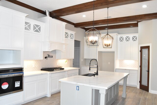 workout room featuring ornamental molding, a towering ceiling, coffered ceiling, and wood ceiling