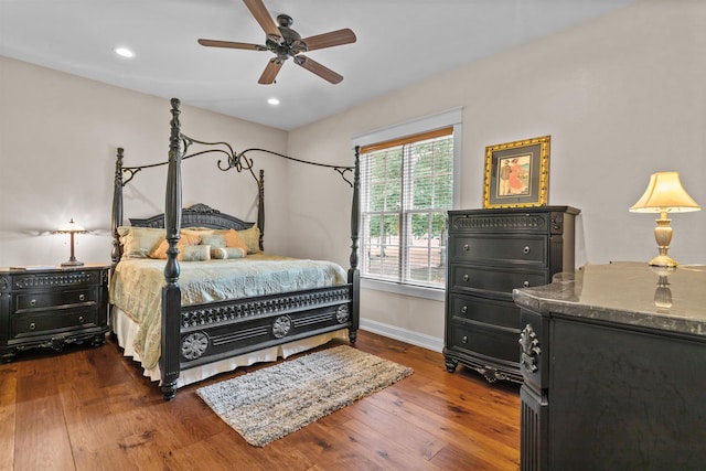 bedroom featuring dark hardwood / wood-style flooring and ceiling fan