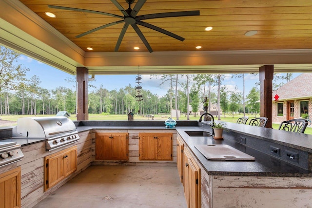 view of patio / terrace with grilling area, area for grilling, ceiling fan, and a wet bar