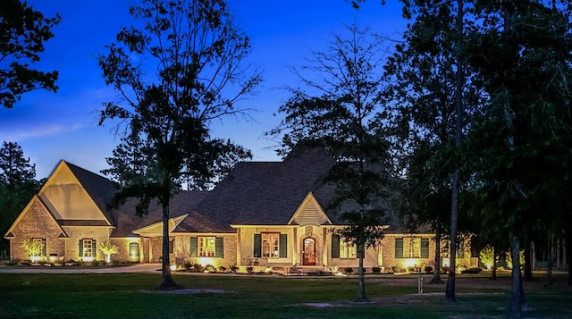 view of front of property with a lawn