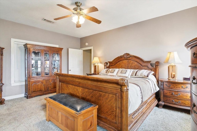 bedroom featuring ceiling fan and light carpet