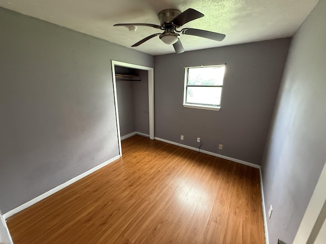 5085 Plant Rd, Beaumont, TX 77708 - unfurnished bedroom with wood finished floors, a closet, and ceiling fan