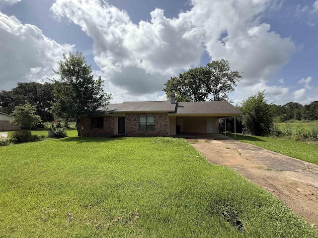 5085 Plant Rd, Beaumont, TX 77708 - single story home with driveway, an attached carport, a front yard, and brick siding
