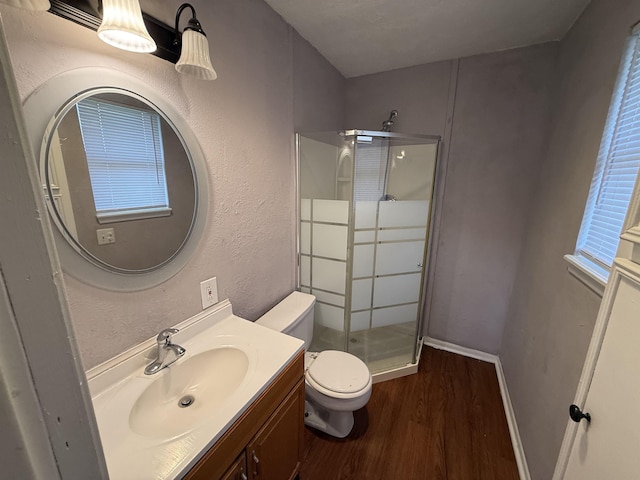 5085 Plant Rd, Beaumont, TX 77708 - full bath featuring a stall shower, wood finished floors, and vanity
