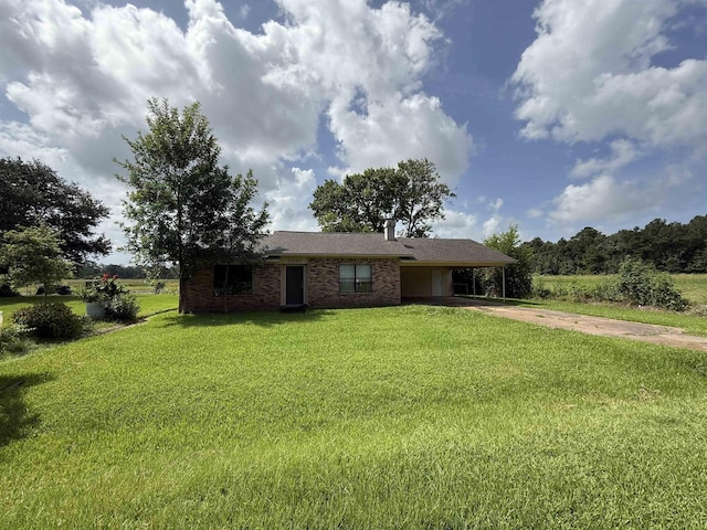 5085 Plant Rd, Beaumont, TX 77708 - ranch-style house featuring an attached carport, concrete driveway, a front yard, and brick siding