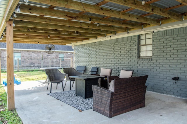 view of patio / terrace featuring an outdoor fire pit