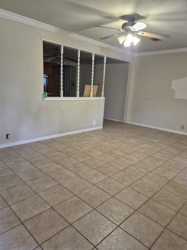 spare room with crown molding and ceiling fan