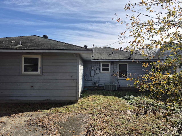 rear view of house with central AC