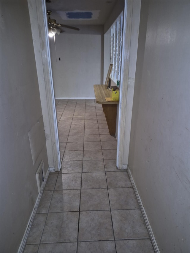 hallway featuring light tile patterned floors