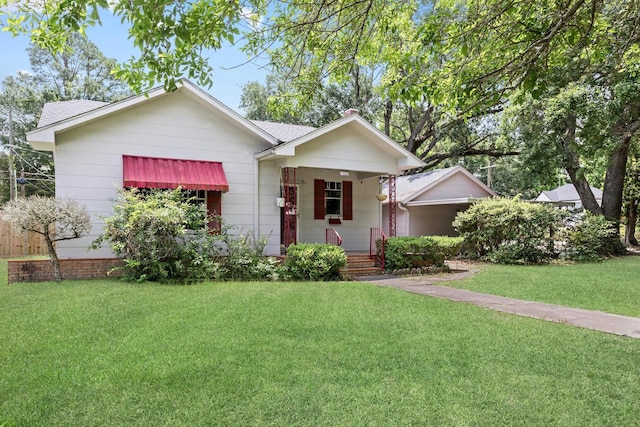 4300 Ferndale Dr, Port Arthur, TX 77642 - view of front of house with a front yard, a porch, and roof with shingles