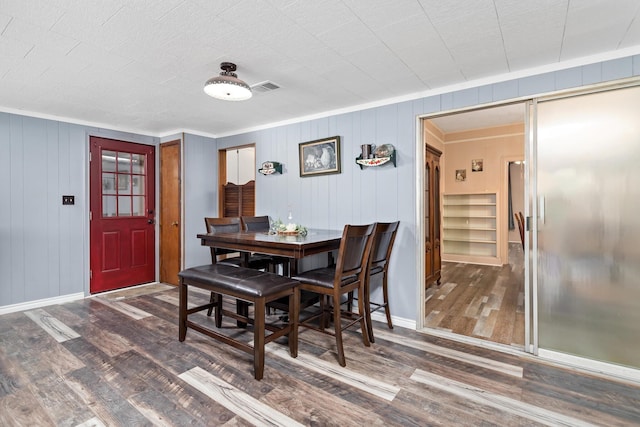 4300 Ferndale Dr, Port Arthur, TX 77642 - dining space featuring wood finished floors and ornamental molding