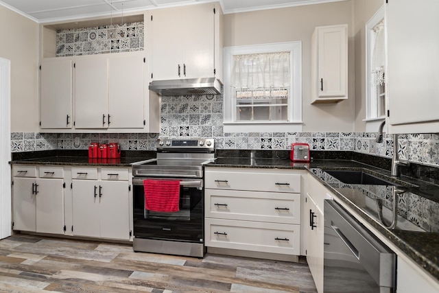4300 Ferndale Dr, Port Arthur, TX 77642 - kitchen featuring stainless steel range with electric cooktop, dishwashing machine, under cabinet range hood, ornamental molding, and decorative backsplash
