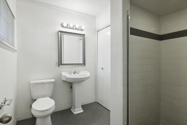 bathroom featuring ornamental molding, a shower, tile patterned floors, and toilet